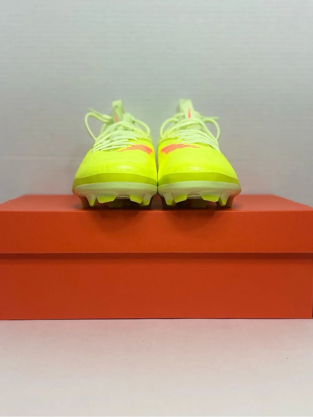 Nike Neon Yellow Soccer Cleats with Orange and Black Accents